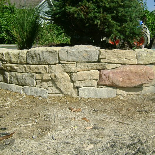 Natural stone retaining wall, landscaping