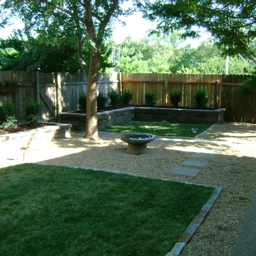 Retaining wall, backyard, trees and shrubs